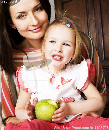 Image of young pretty stylish mother with little cute daughter hugging, happy smiling family, lifestyle people concept 