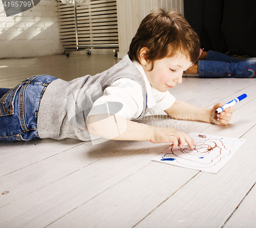 Image of little cute boy painting at home, lifestyle people concept