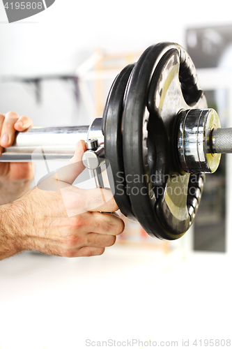 Image of Barbell, the coach does load