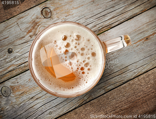 Image of beer mug on wooden table