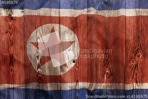 Image of National flag of North Korea, wooden background