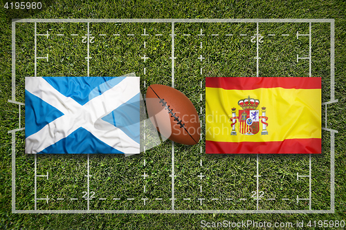 Image of Scotland vs. Spain flags on rugby field