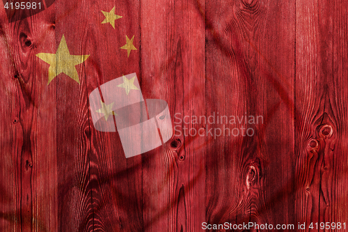 Image of National flag of China, wooden background