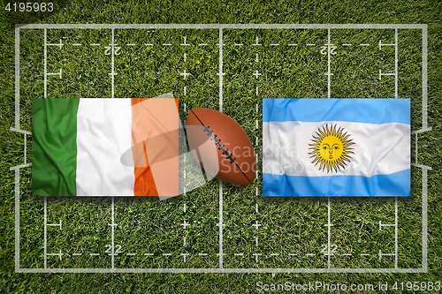 Image of Ireland vs. Scotland\r\rIreland vs. Argentina flags on green rugby