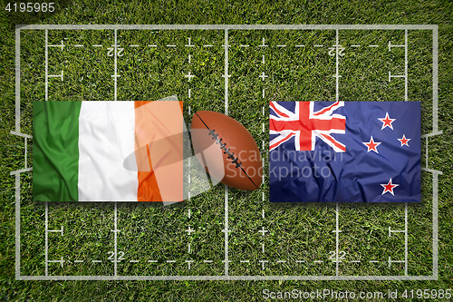 Image of Ireland vs. New Zealand\r flags on rugby field
