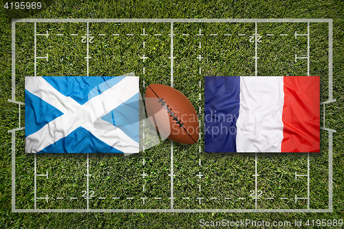 Image of Scotland vs. France flags on rugby field