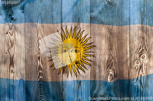 Image of National flag of Argentina, wooden background