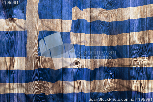 Image of National flag of Greece, wooden background
