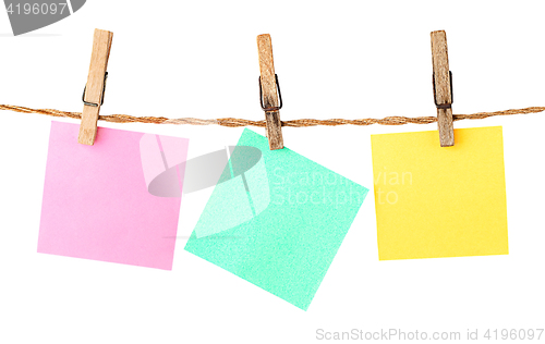 Image of Multicolored paper stickers on clothespins