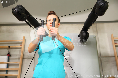 Image of Gym, exercise the muscles of the back. Gym, training with rubbers.