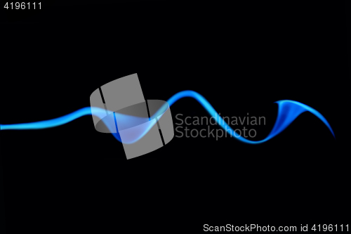 Image of Trickle Of Blue Smoke On Black Background