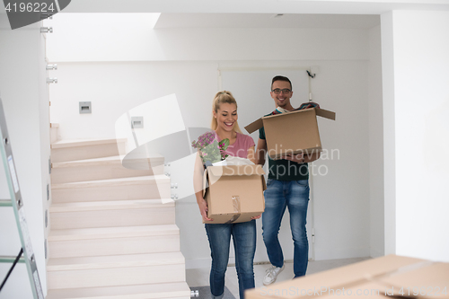 Image of young couple moving into a new home