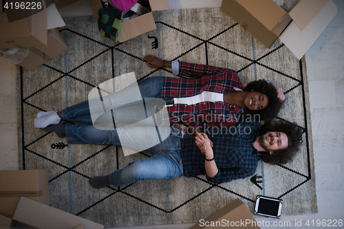 Image of Top view of attractive young multiethnic couple