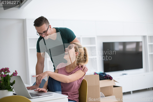 Image of Young couple moving in a new home