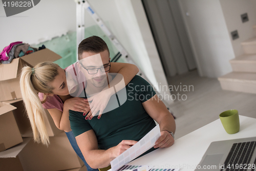 Image of Young couple moving in a new home