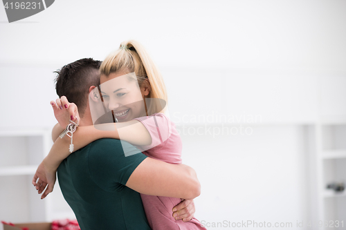 Image of happy Young couple moving in new house