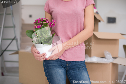 Image of girl moving in the new apartment