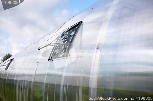 Image of greenhouse with open window