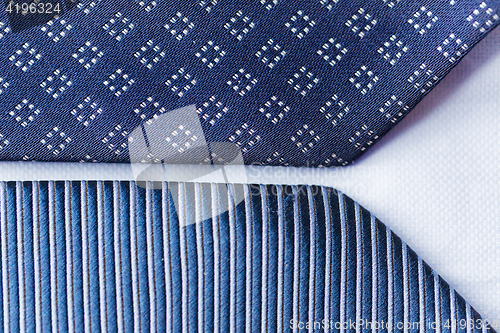 Image of close up of blue patterned ties