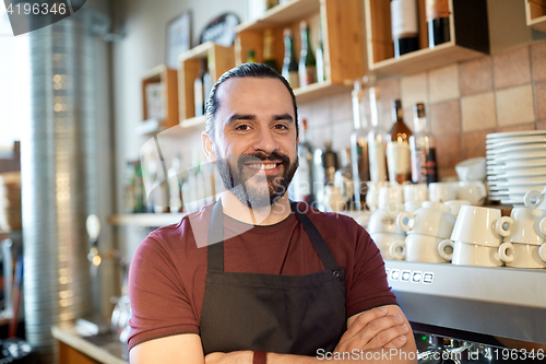 Image of happy man, barman or waiter at bar