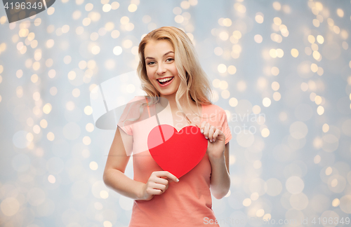 Image of happy woman or teen girl with red heart shape