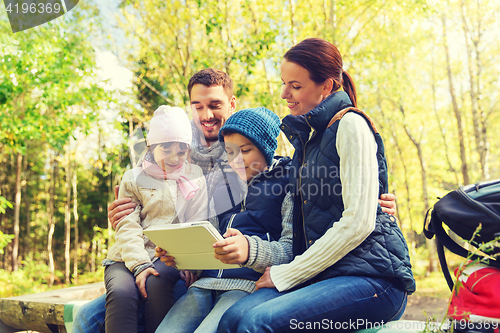 Image of happy family with tablet pc and backpacks at camp