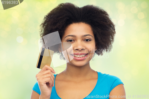 Image of happy african american woman with credit card