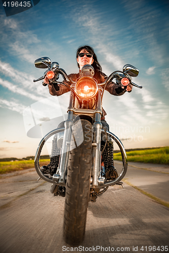 Image of Biker girl on a motorcycle