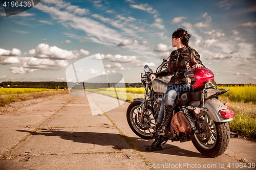 Image of Biker girl on a motorcycle