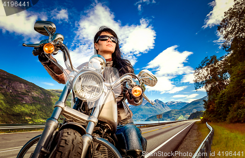 Image of Biker girl on a motorcycle