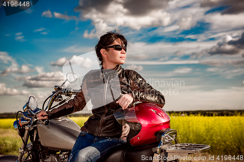 Image of Biker girl on a motorcycle