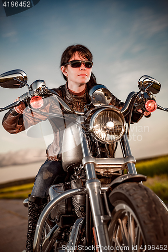 Image of Biker girl on a motorcycle