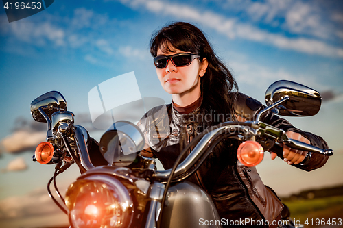 Image of Biker girl on a motorcycle