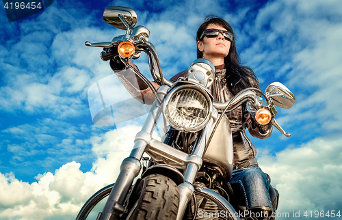 Image of Biker girl on a motorcycle