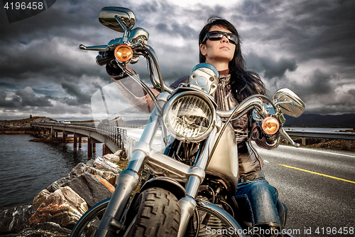 Image of Biker girl on a motorcycle