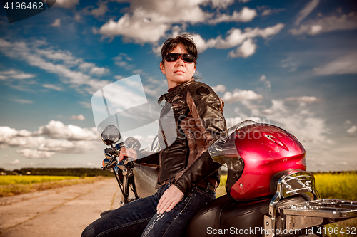 Image of Biker girl on a motorcycle