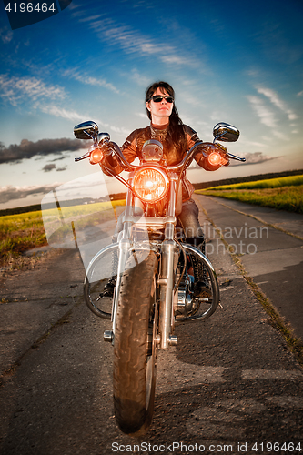 Image of Biker girl on a motorcycle