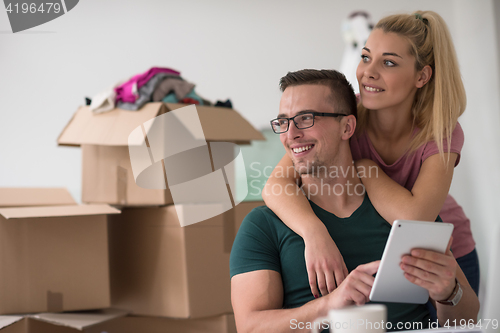 Image of Young couple moving in a new home