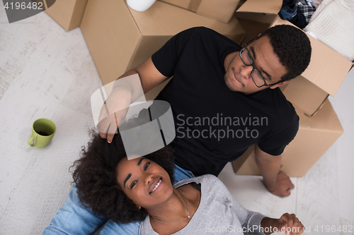 Image of African American couple relaxing in new house