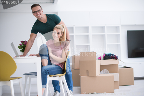 Image of Young couple moving in a new home