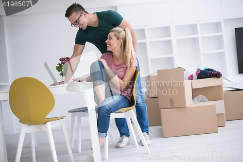 Image of Young couple moving in a new home