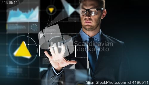 Image of businessman touching virtual screen projection