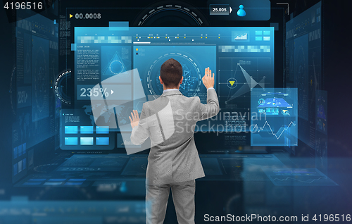 Image of businessman working with virtual screens