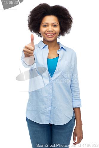 Image of happy african american woman showing thumbs up