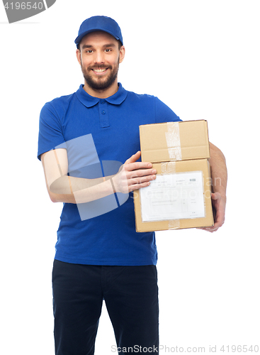 Image of happy delivery man with parcel boxes