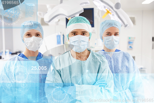 Image of group of surgeons in operating room at hospital