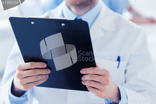 Image of close up of doctor with clipboard at hospital