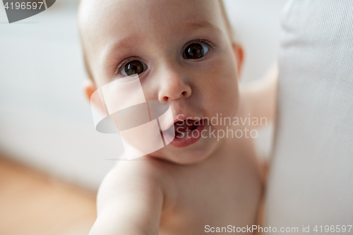 Image of close up of happy little baby boy or girl at home