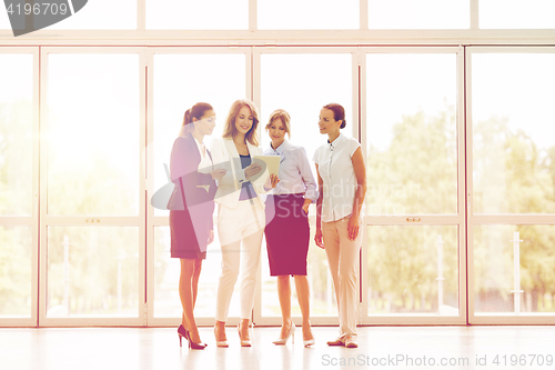Image of business people with tablet pc computer at office