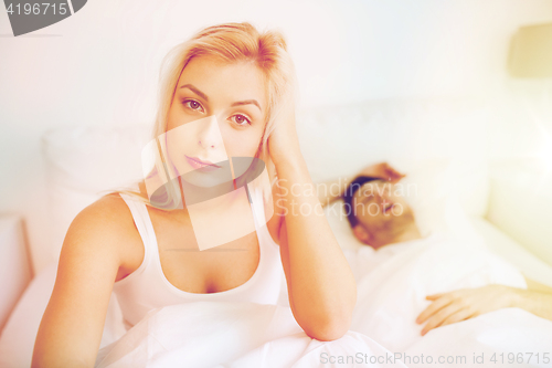 Image of awake woman having insomnia in bed